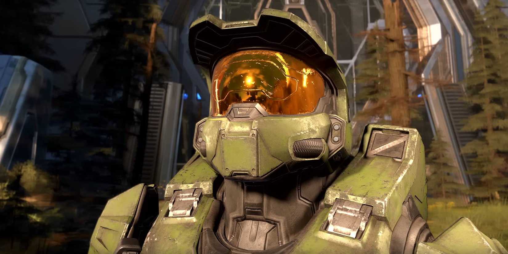 Halo Infinite Master Chief looking up at larger ring world.