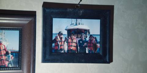 The Front Man and Captain Park in a photo on a boat in Squid Game season 3