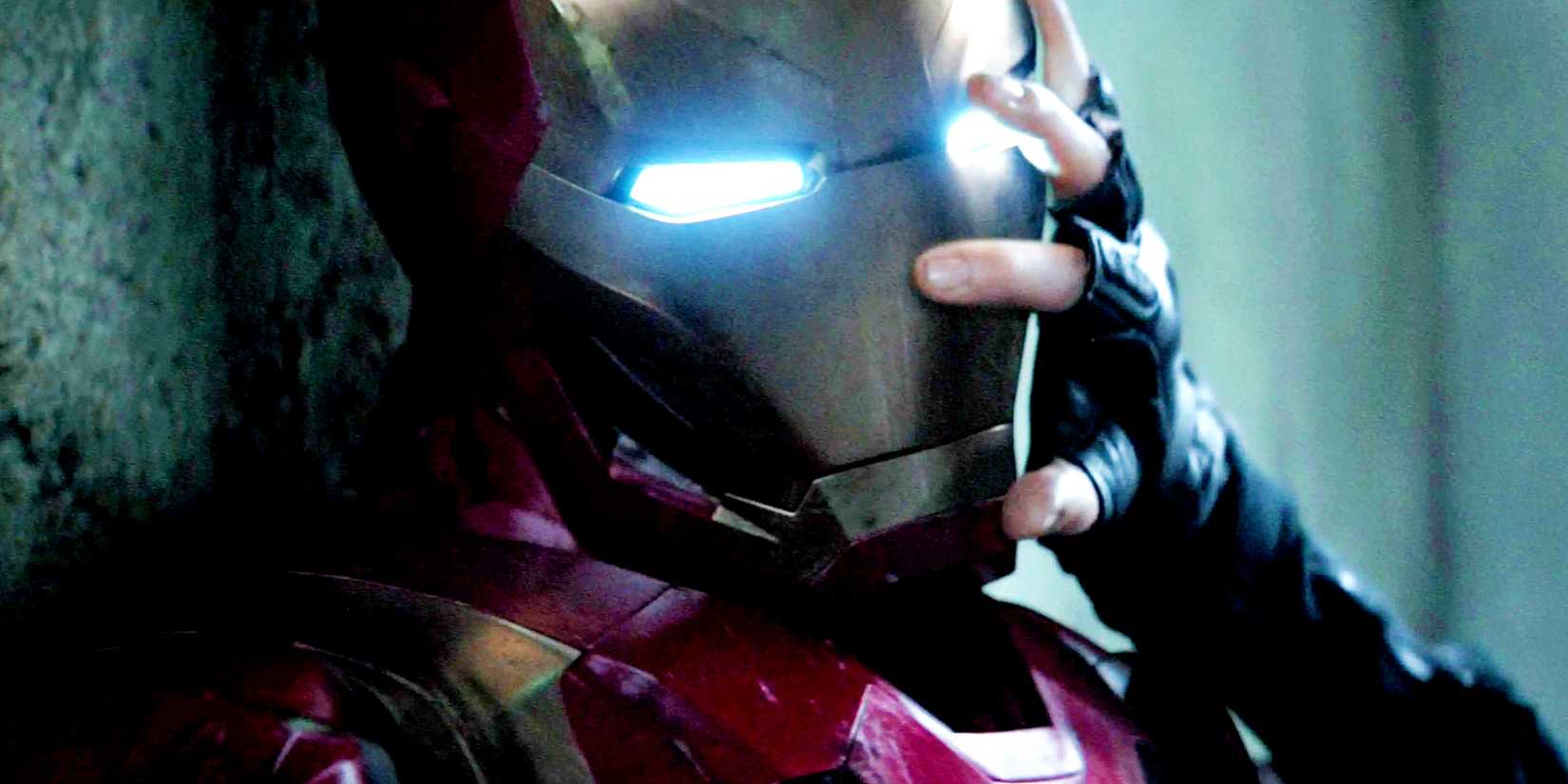 Iron Man having his head pushed against a wall by Bucky Barnes in Captain America Civil War