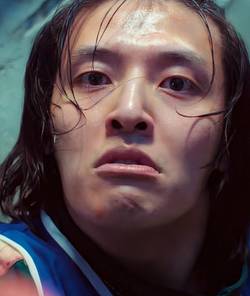 Kang Ha-neul raising his knife up at Gi-hun in Squid Game season 3