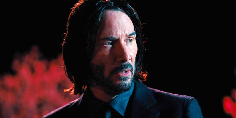 Keanu Reeves looking to the side in John Wick Chapter 4