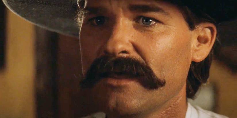 Kurt Russell as Wyatt Earp looking surprised in Tombstone