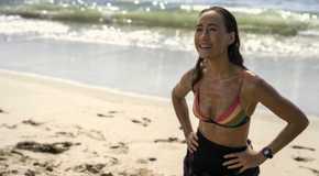 Renee Ballard stands on the beach smiling in Ballard season 1