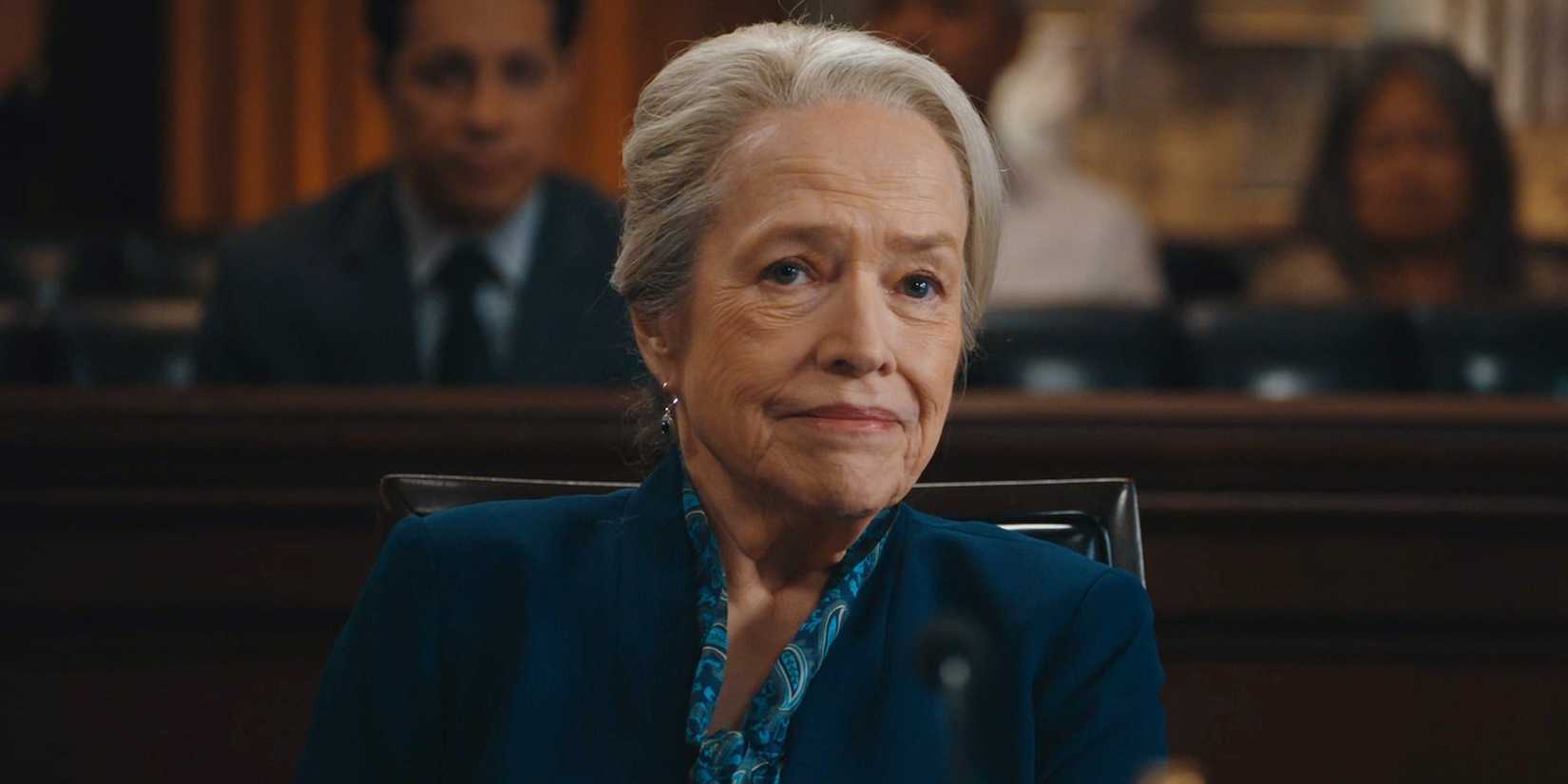 Matty (Kathy Bates) trying to smile while in court in Matlock