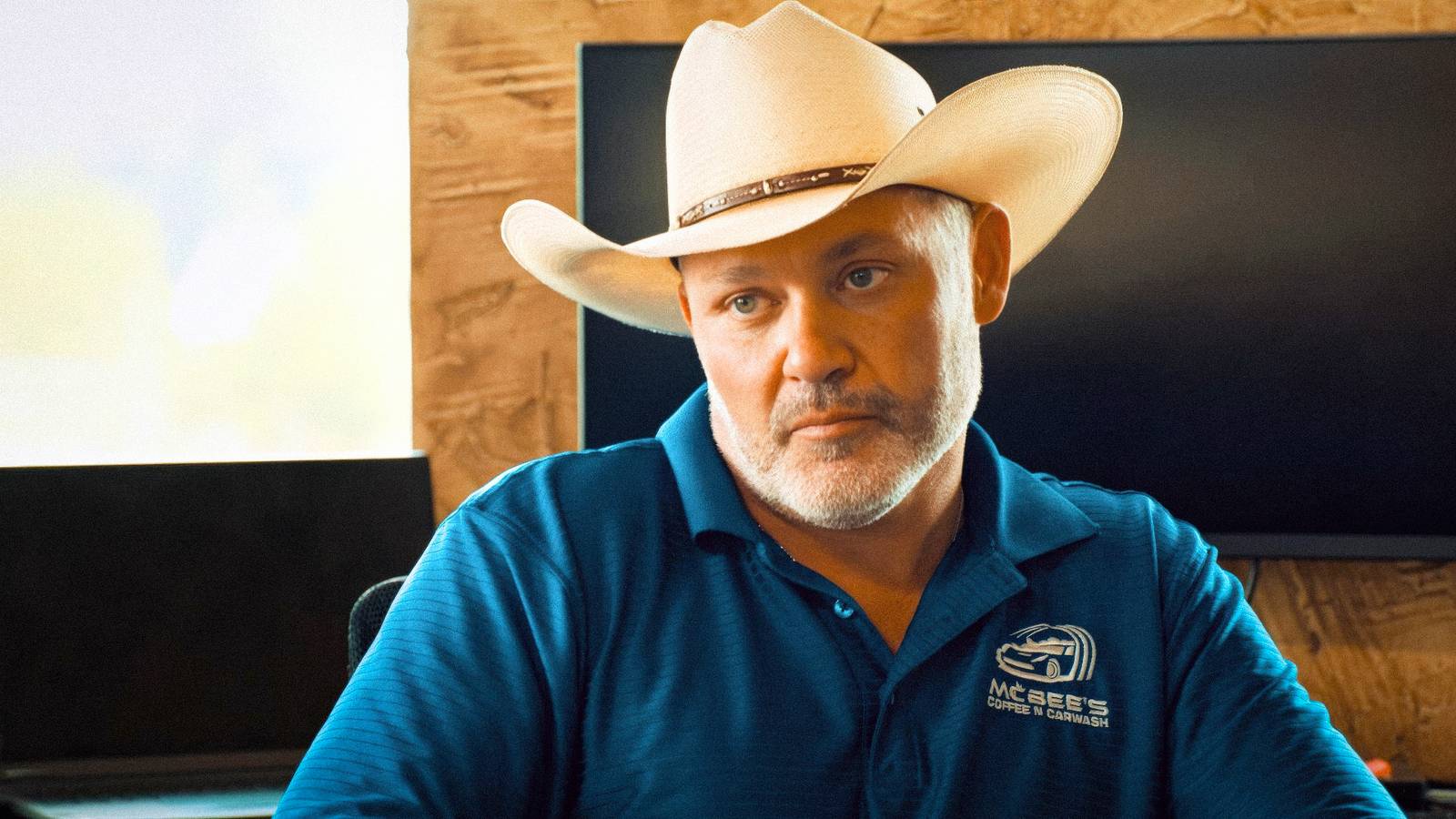 The McBee Dynasty's Steve McBee with a serious expression while wearing a cowboy hat