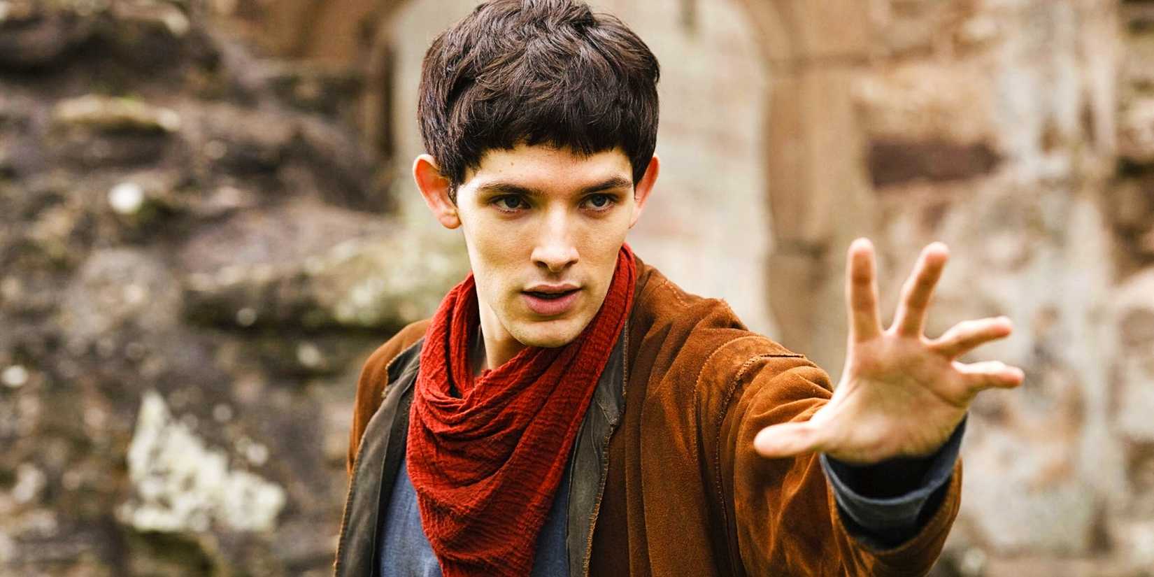 Merlin (Colin Morgan) holding up his hand to perform magic in Merlin.