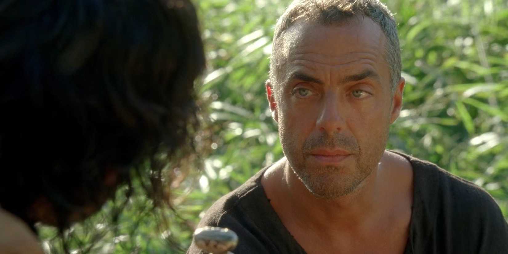 Man in Black (Titus Welliver) offering Richard (Nestor Carbonell) a knife in Lost