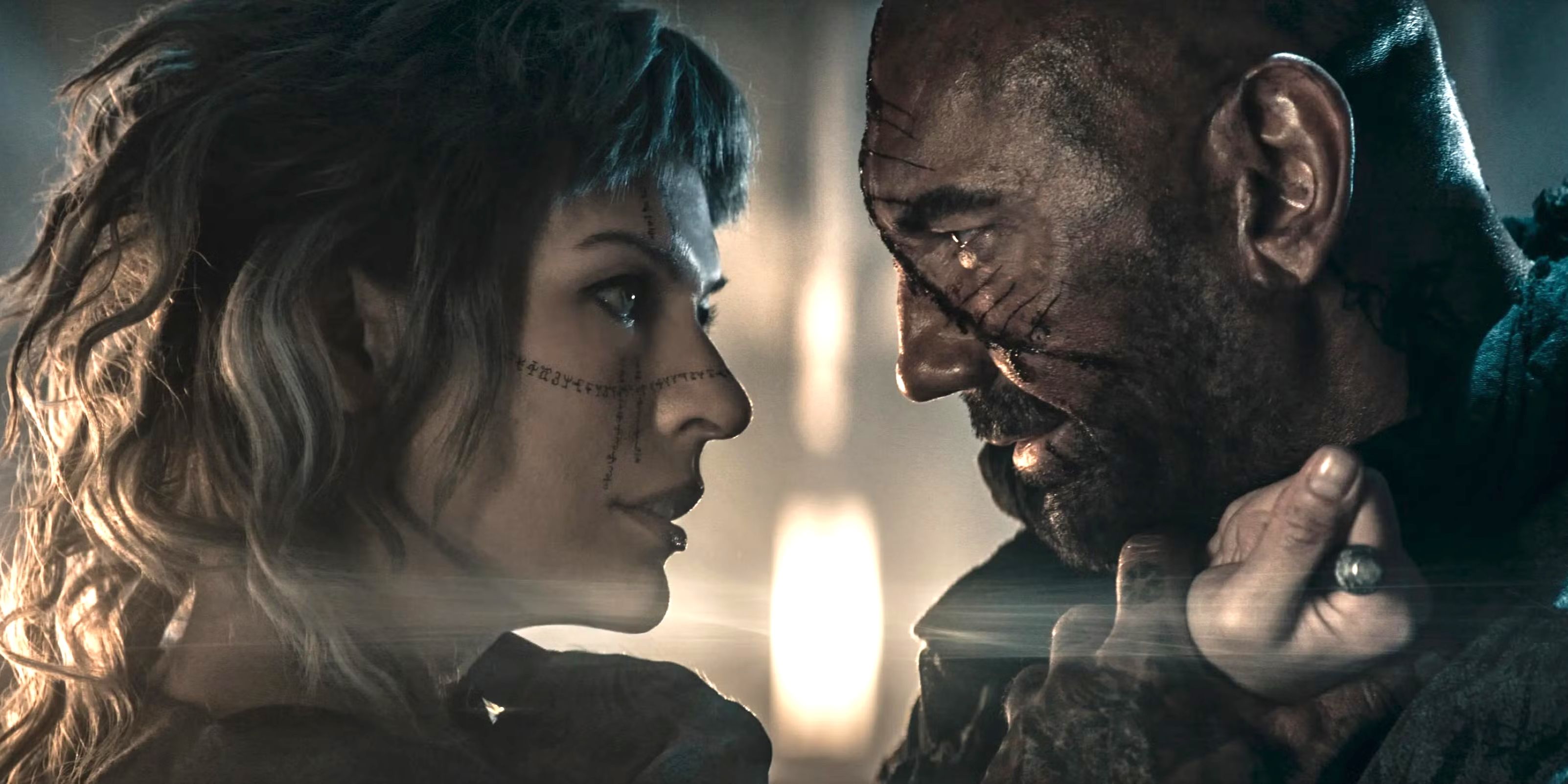 Milla Jovovich as Gray Alys and Dave Bautista as Boyce in In the Lost Lands copy
