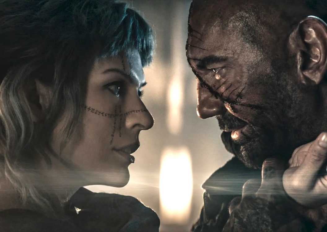 Milla Jovovich as Gray Alys and Dave Bautista as Boyce in In the Lost Lands copy
