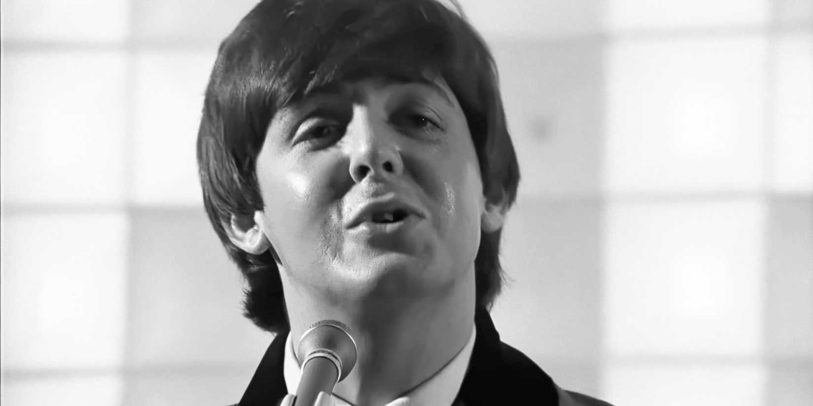 Paul McCartney performs with the Beatles in a scene from A Hard Day's Night