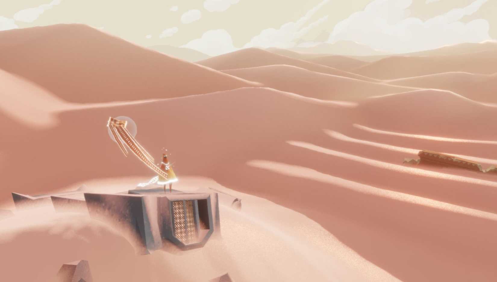 Player walking through a vast desert in Journey