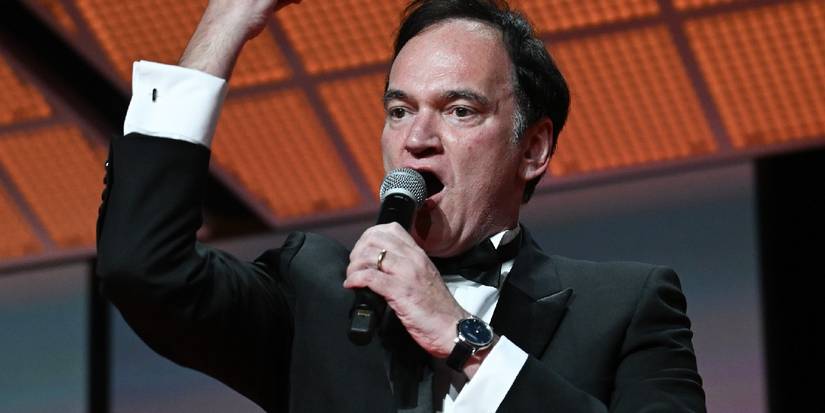 Quentin Tarantino shouting into a microphone