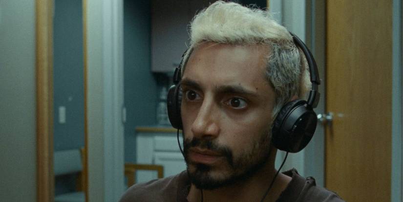 Riz Ahmed wearing headphones as Ruben in Sound of Metal
