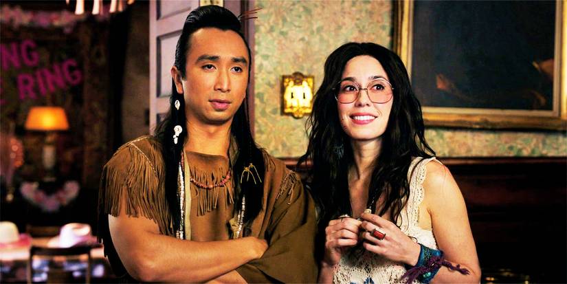 Sass and Flower standing together in an episode of Ghosts