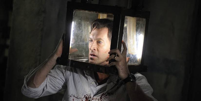 Scott Patterson com a cabeça em uma caixa em Saw V