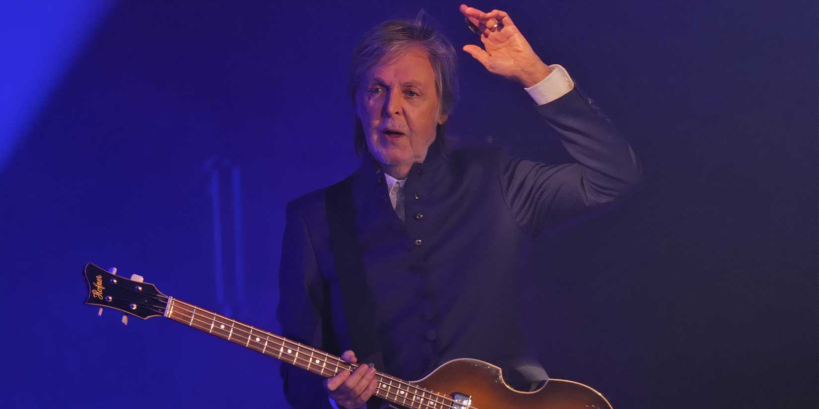 Sir Paul McCartney plays the guitar onstage during a performance at Glastonbury.