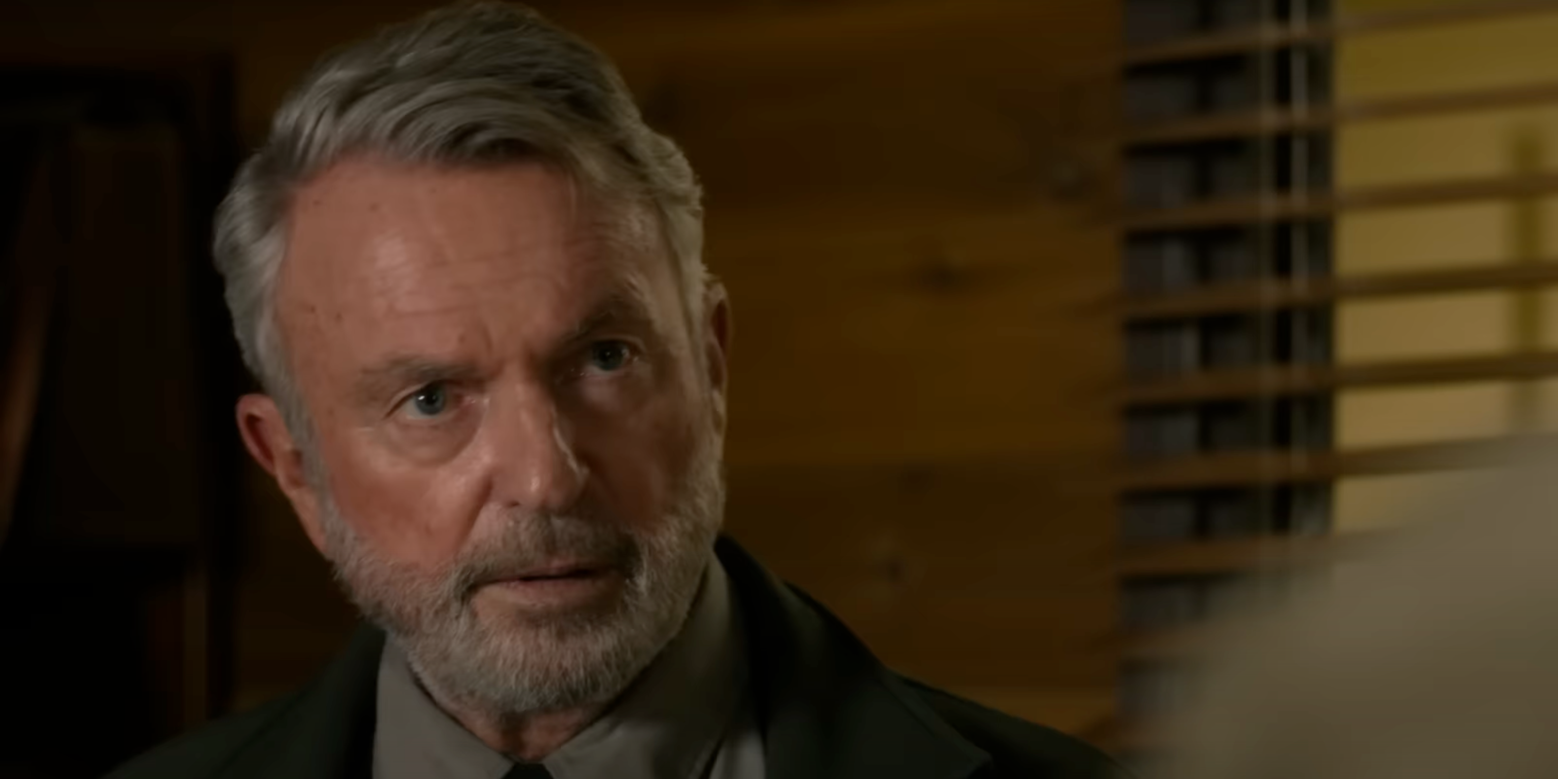 Sam Neill talking to someone in Untamed