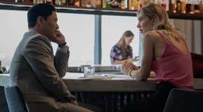 Randall Park and Vanessa Kirby speak at a bar in Night Always Comes