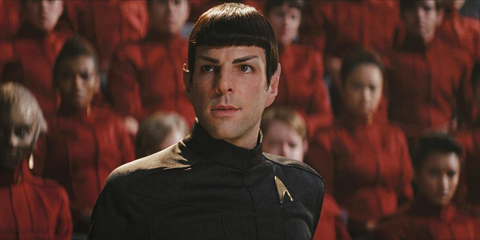 Spock looks on intensely with many cadets behind him at the military tribunal in Star Trek 2009