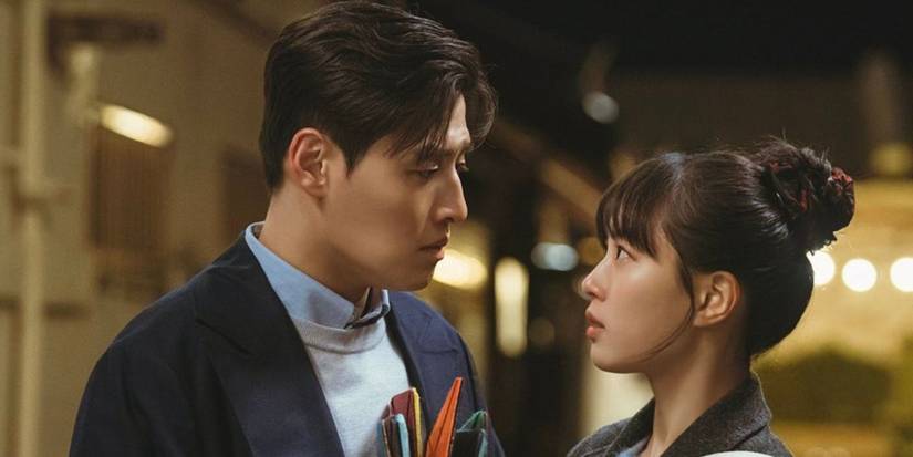 Go Min-si and Kang Ha-neul looking at each other lovingly in Tastefully Yours