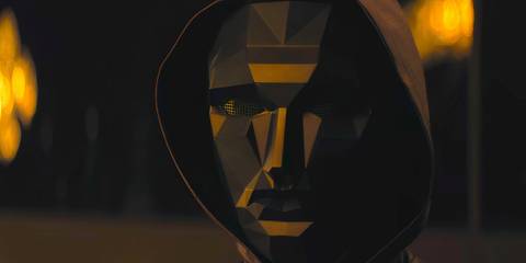 The Front Man looking ahead with his mask on in Squid Game season 3 episode 4