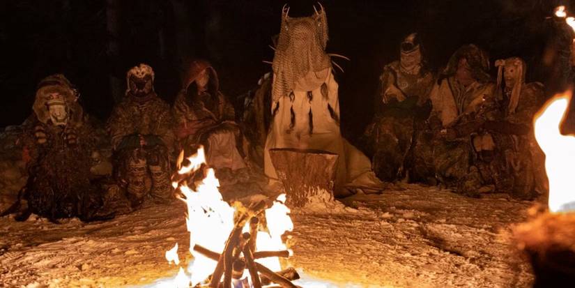 The girls sit around a campfire in Yellowjackets