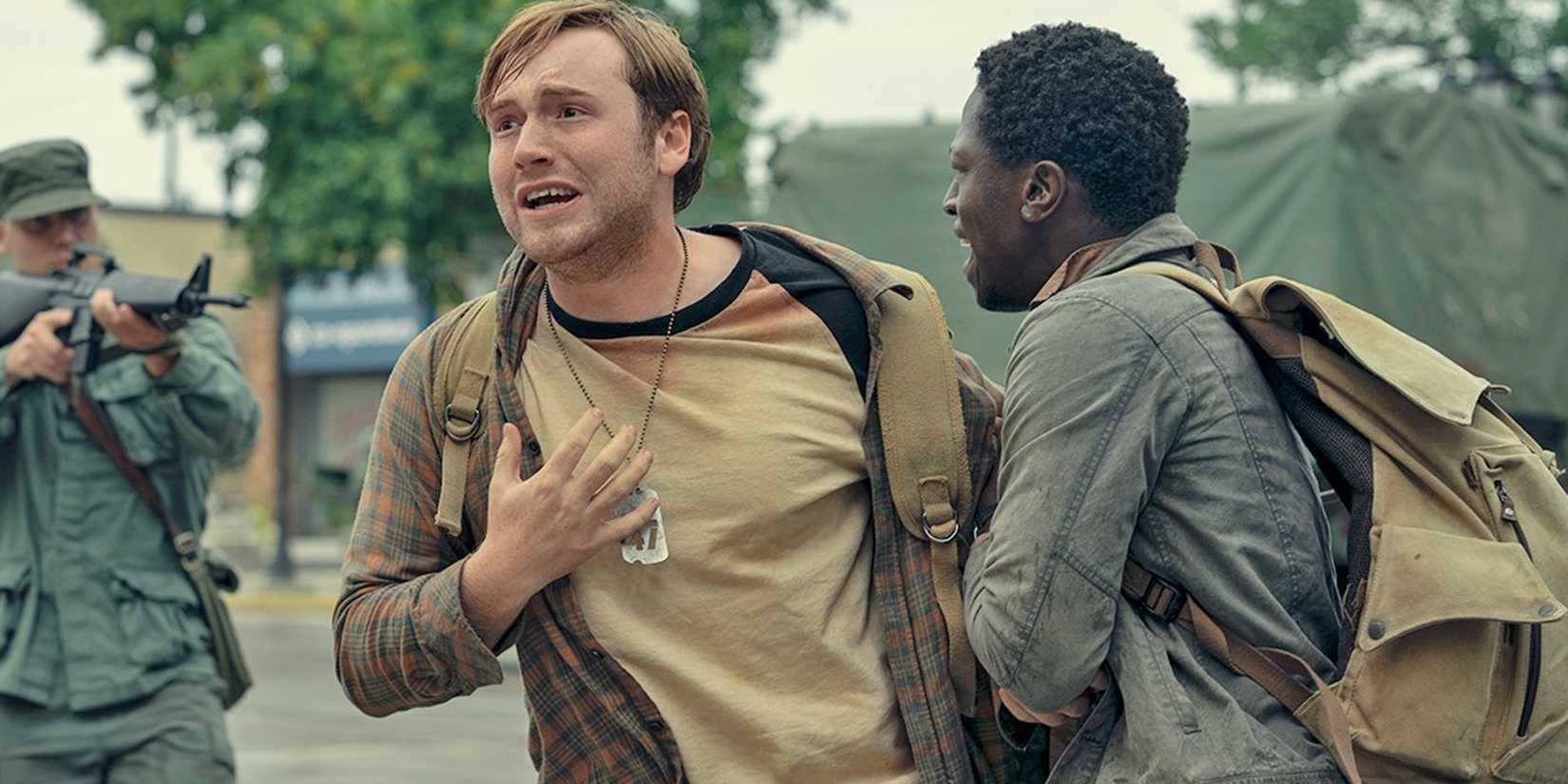 David Jonsson holding onto a distressed Cooper Hoffman in The Long Walk