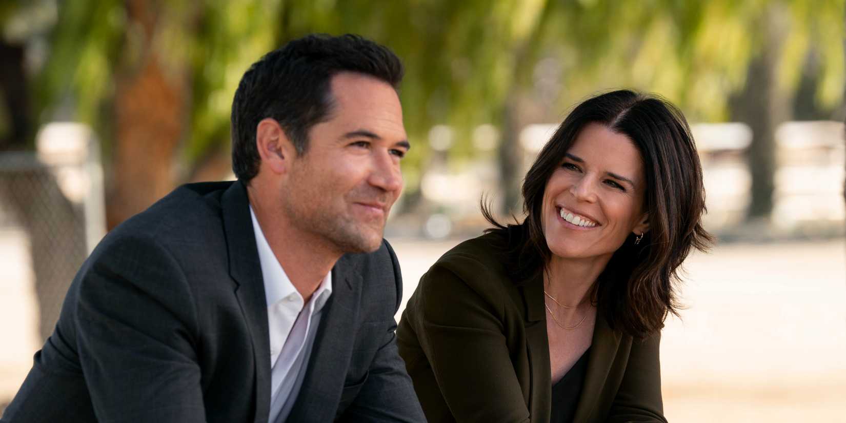 Maggie smiles at Mickey in The Lincoln Lawyer season 2.