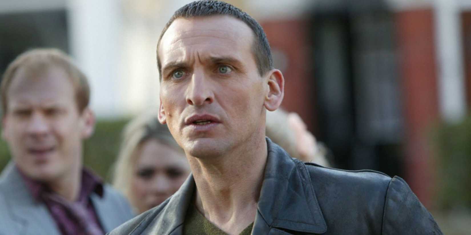 Christopher Eccleston as the Ninth Doctor looking shocked as he sees a Reaper outside the church in the Doctor Who season 1 episode "Father's Day."