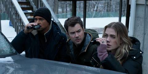 Main characters watching in binoculars in Manifest