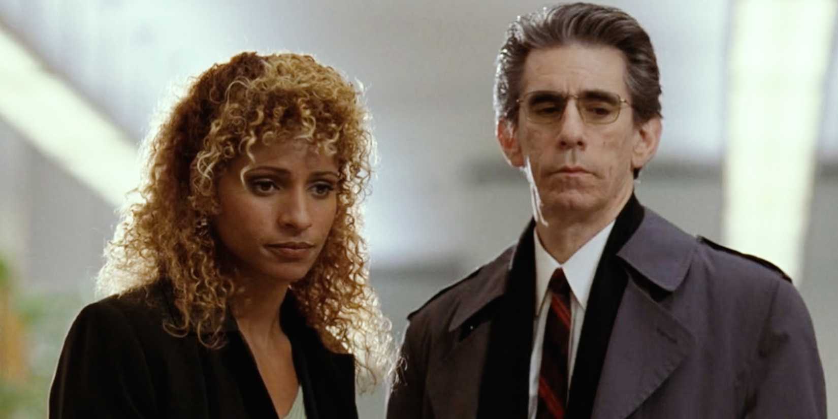 Detective Jeffries (Michelle Hurd) and Detective Munch (Richard Belzer) looking serious in Law & Order: SVU