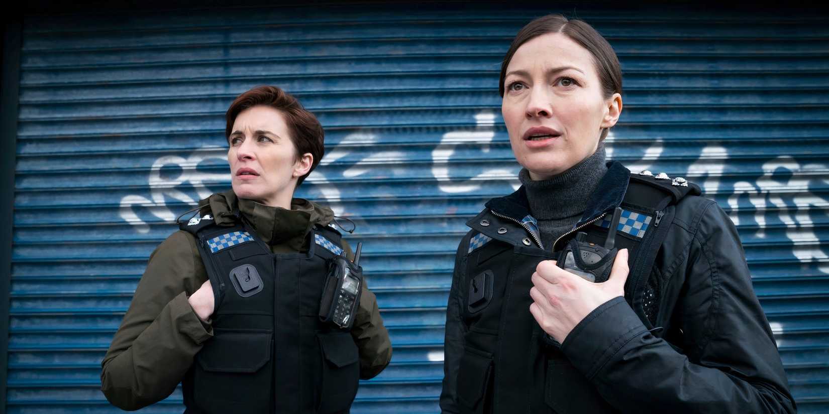 Police officers looking at something in the distance on Line of Duty