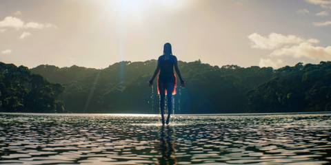 A woman floats on water in Evil Dead Rise