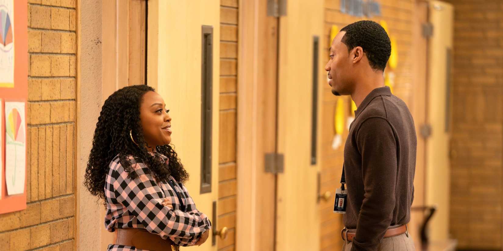 Janine and Gregory talking in the hallway in Abbott Elementary