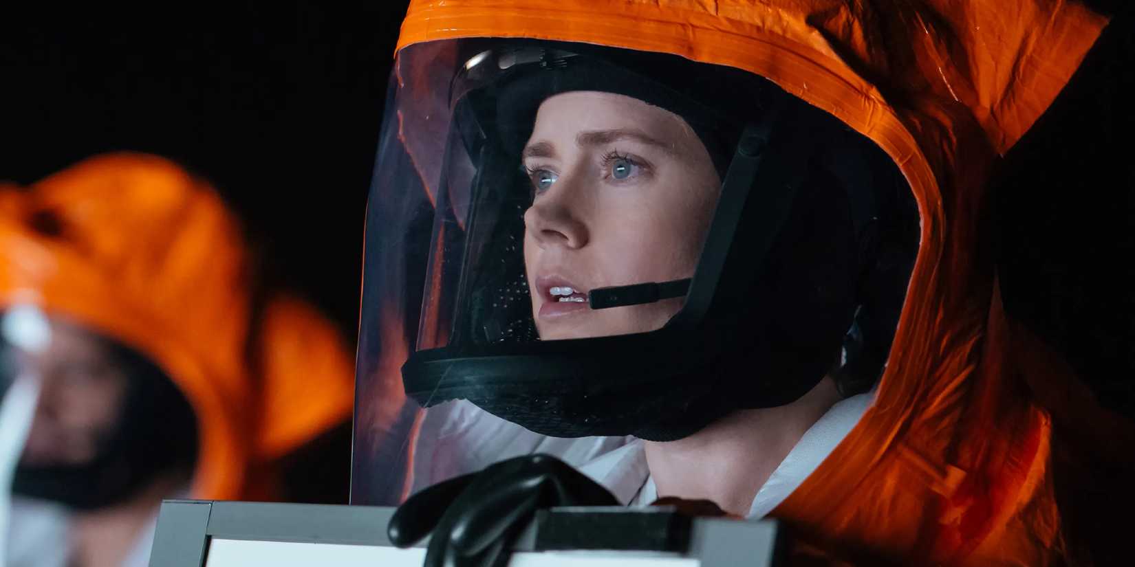 Amy Adams as Dr.  Louise Banks wearing an orange haz mat suit in Arrival