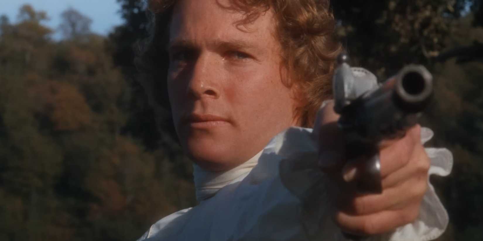 Barry Lyndon pointing a dueling pistol in close-up in Barry Lyndon