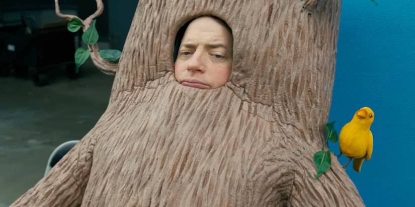 Brendan Fraser dressed as a tree in Rental Family 