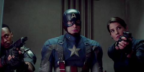 Captain America in full costume looking confident while Sam Wilson and Maria Hill hold guns beside him in Captain America the Winter Soldier-1