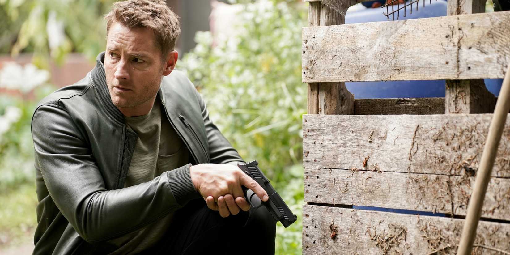 Justin Hartley as Colter Shaw crouching with a gun in Tracker season 2