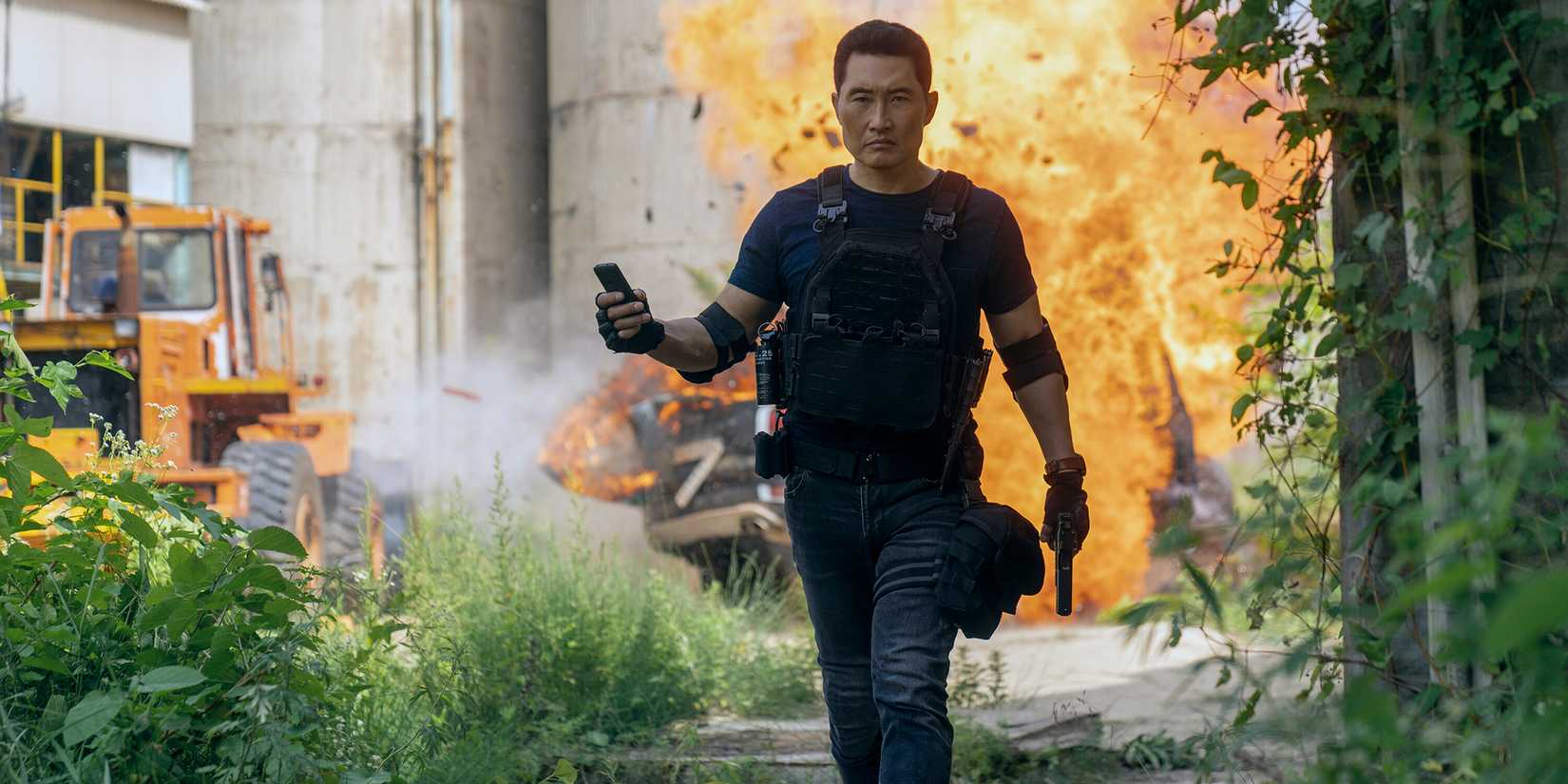 Daniel Dae Kim as David looking intense and walking away from an explosion in Butterfly