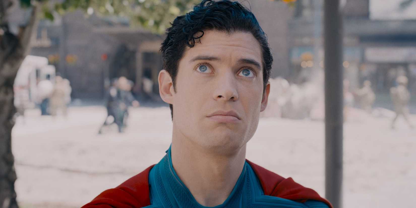 David Corenswet As Superman Looking At A Crack In The Wall