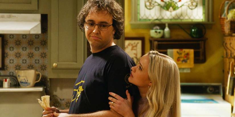 Dougie Baldwin as Connor and Emily Osment as Mandy hugging in Georgie & Mandy's First Marriage season 1, episode 16