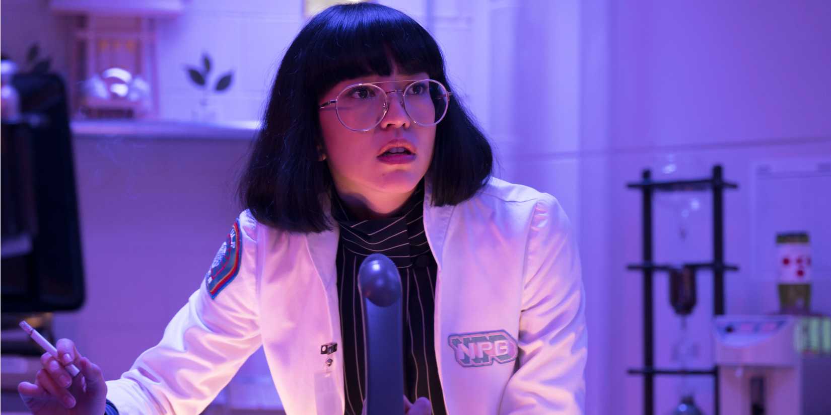 Dr. Azumi Fuita (Sonoya Mizuno) in a labcoat looking anxious in Maniac