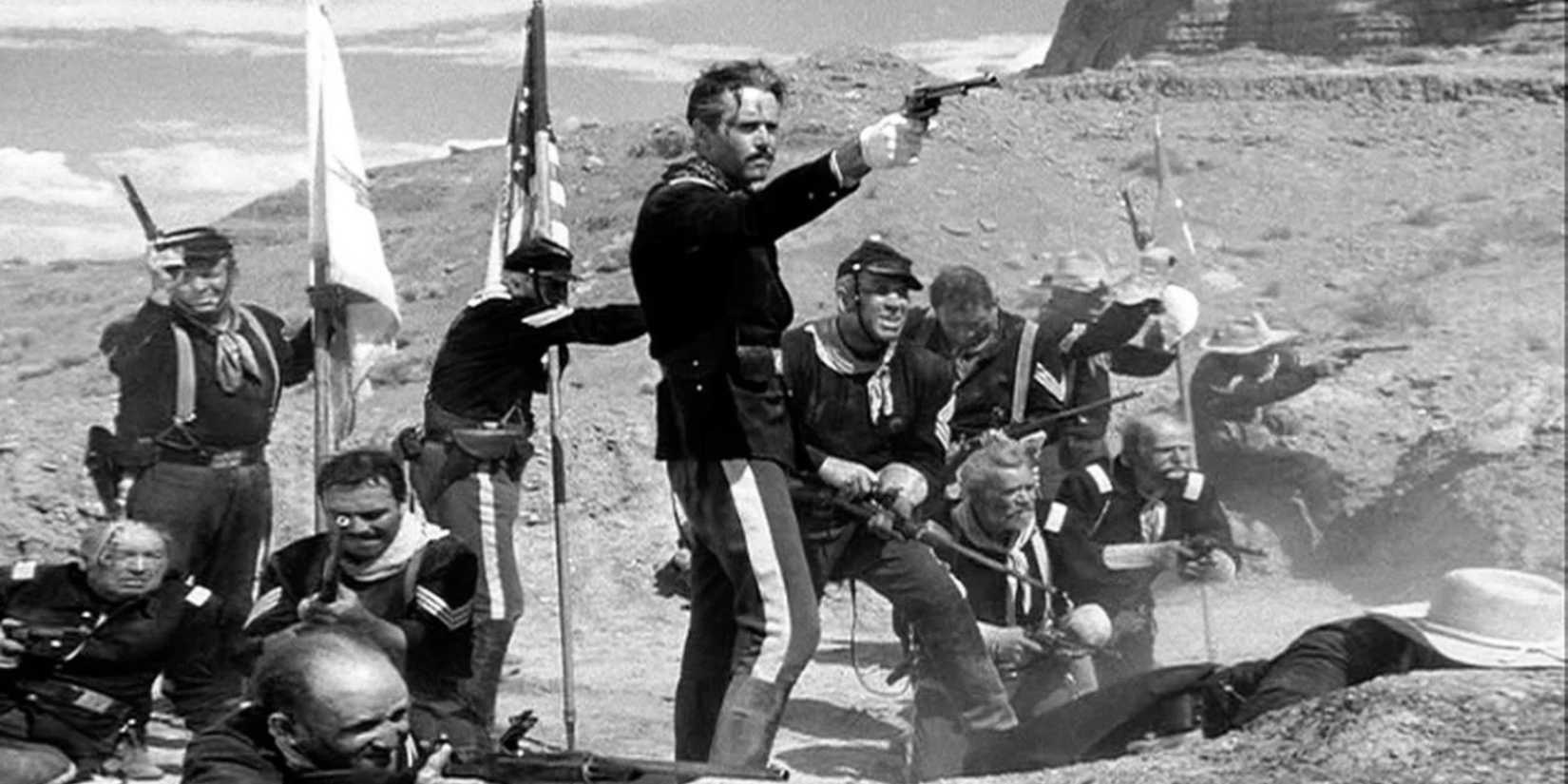 Henry Fonda aims a pistol during a gunfight in Fort Apache