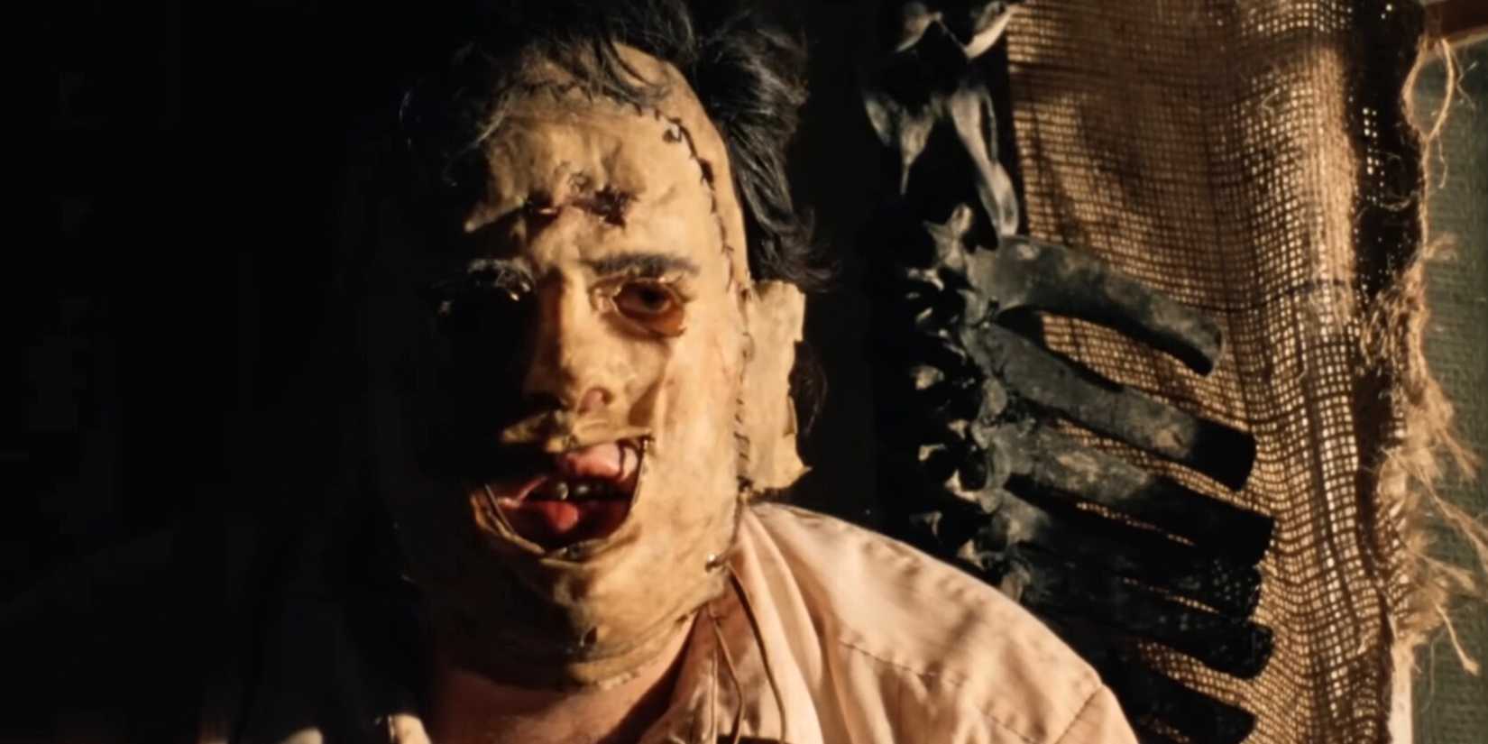 Gunner Hansen as Leatherface sitting by a window in Texas Chainsaw Massacre