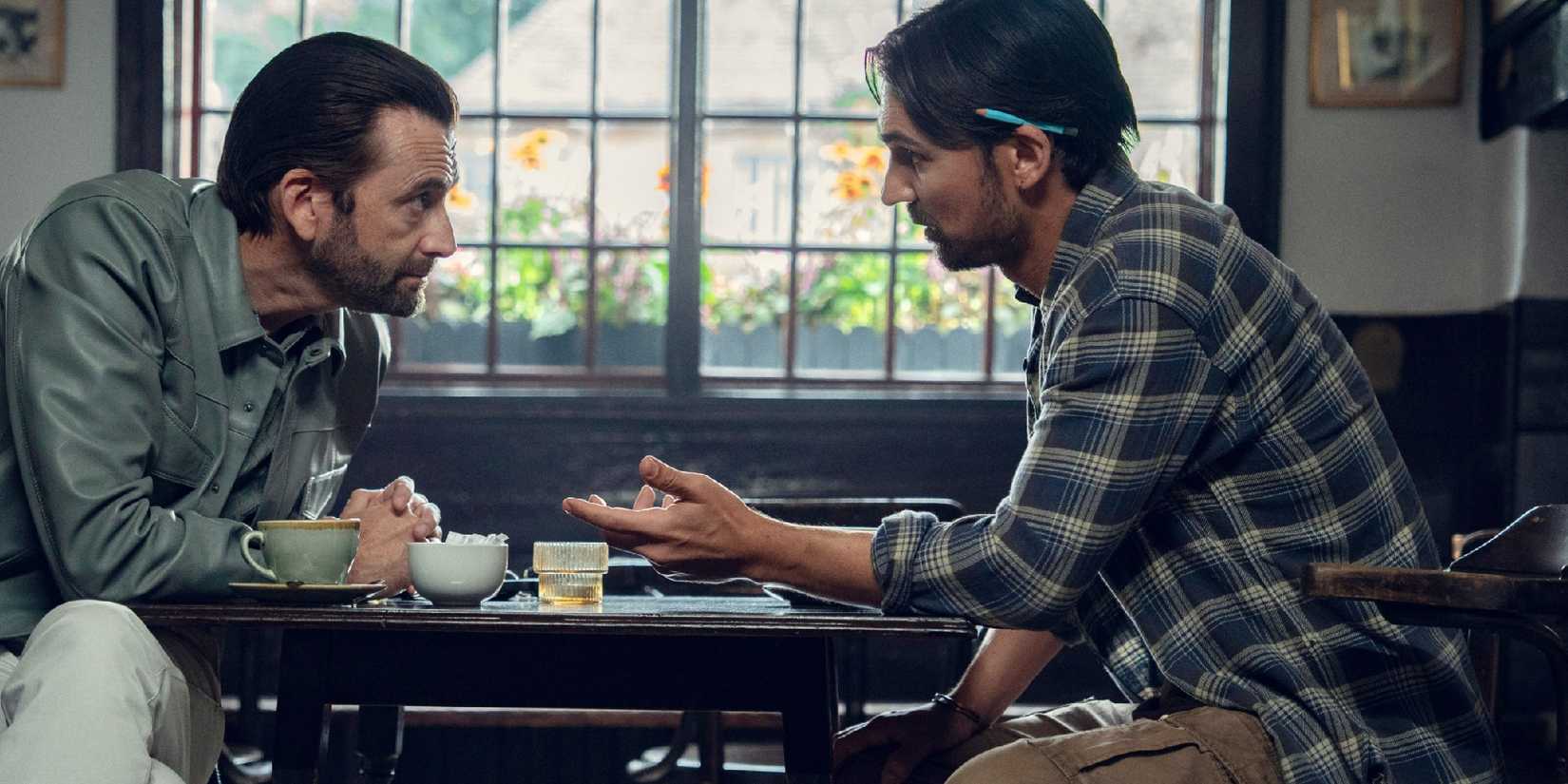 Ian and Bogdan chat at the Red Lion Pub in The Thursday Murder Club