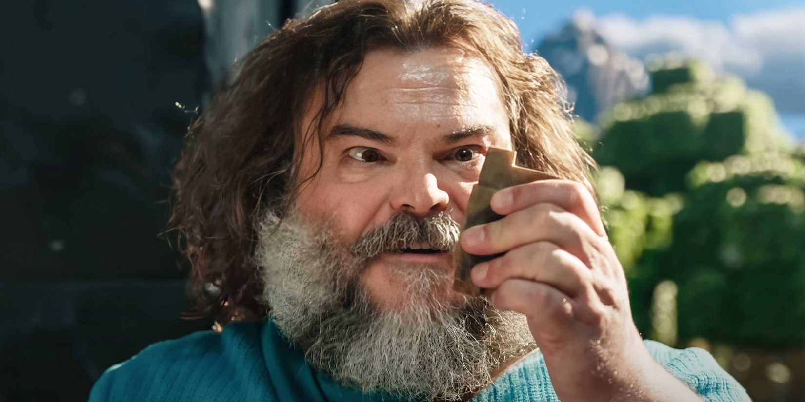 Jack Black looking at a block in Minecraft movie