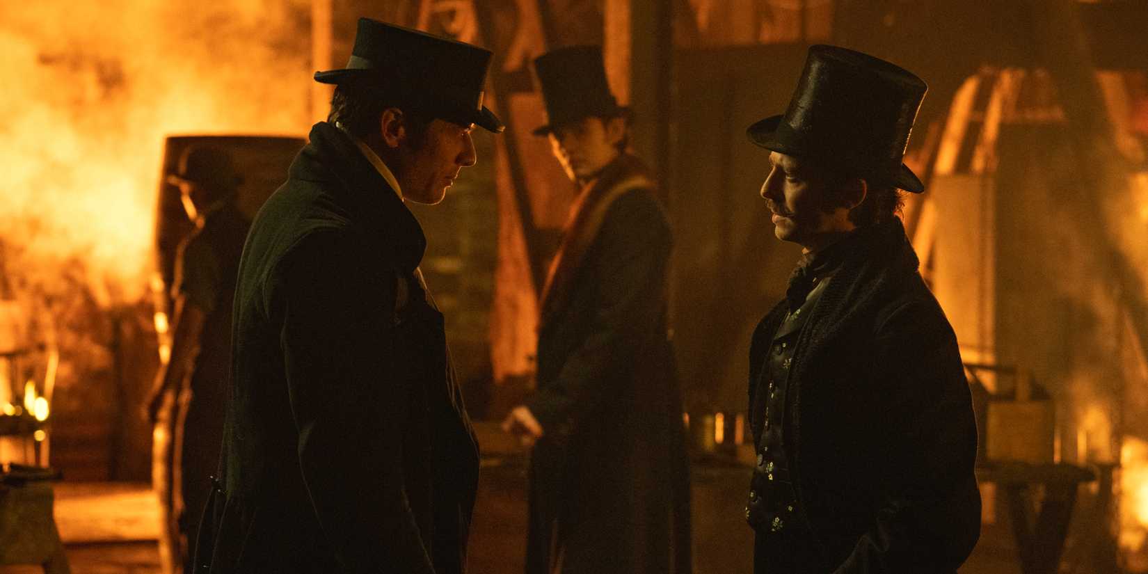 James, Norton and Anthony Boyle talking with Louis Partridge behind them from House of Guinness