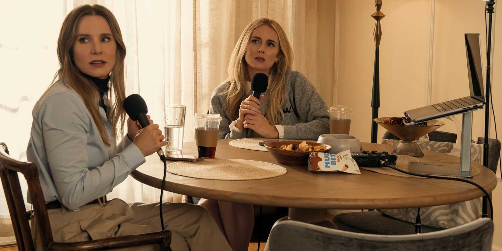 Joanne and Morgan looking upset at something while at their podcasting table in Nobody Wants This season 2