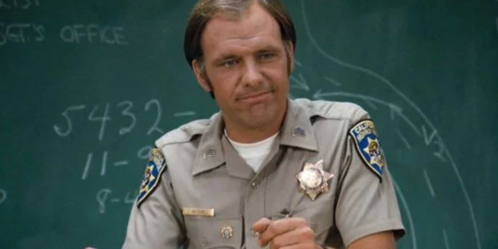 CHIPS Joe Getraer in front of the roll call board